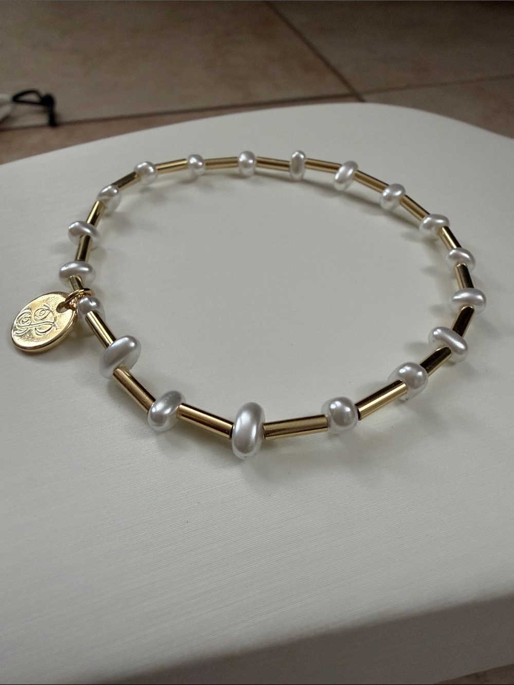 Plunder Gold Tone and White Pearl Stretch Bracelet with Logo Charm - Picture 3 of 4